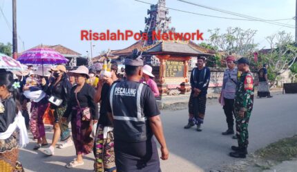 BABINSA KORAMIL 05/BANJIT SERDA DENARA DELI, KUSUP Upacara Masal Pitra Yadnya Ngaben di daerah Kampung Bali Sadar Tengah, Distrik Banjit